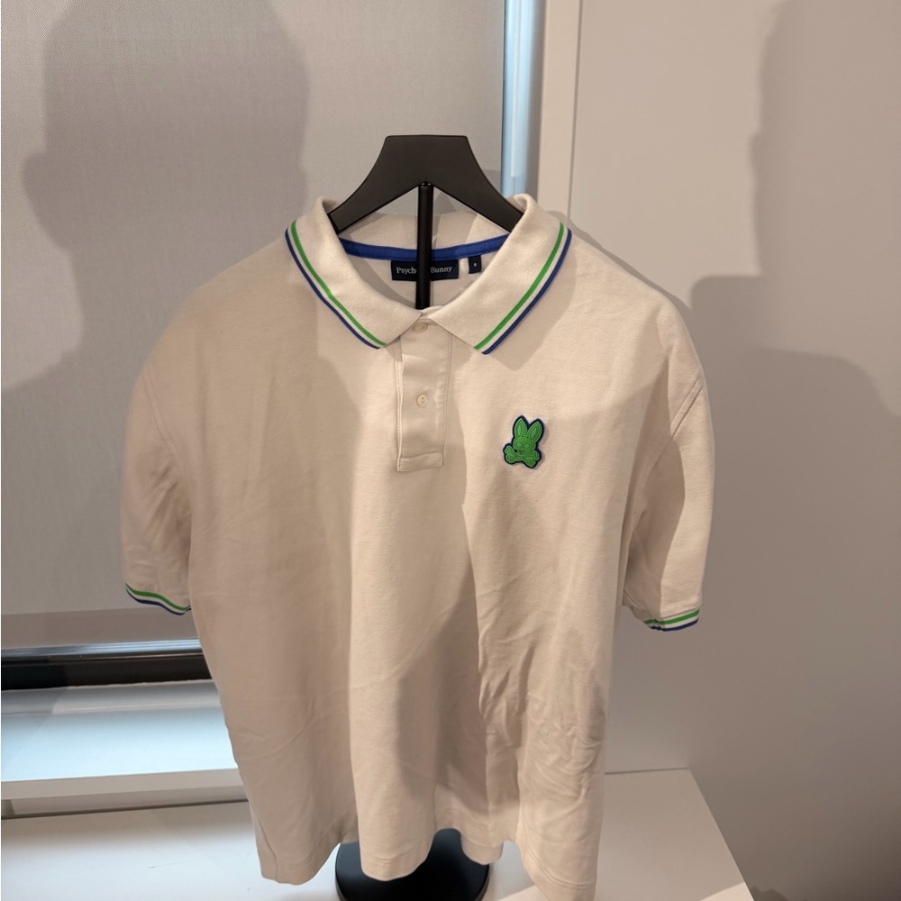 White Polo Shirt with Green Logo